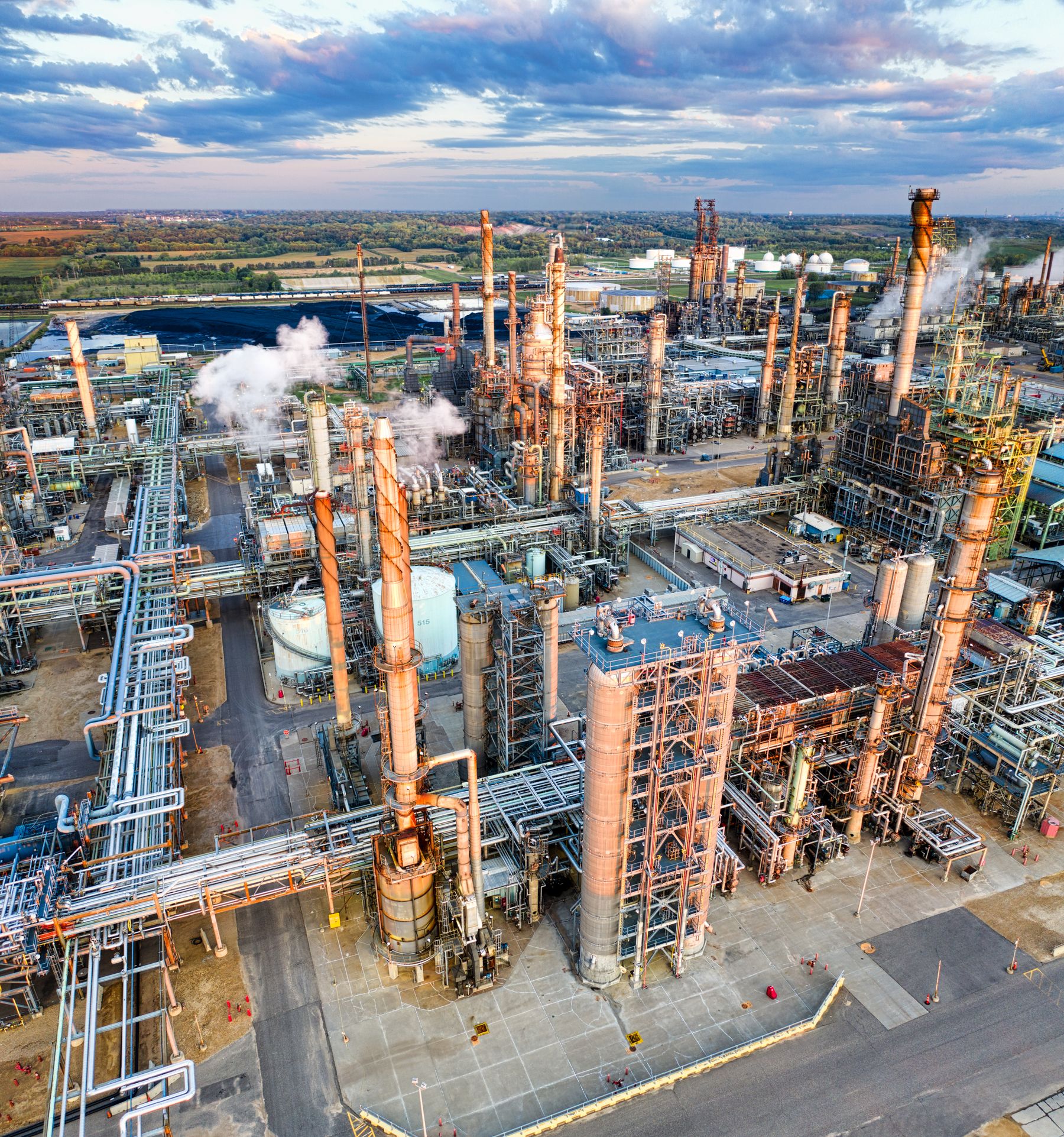 Aerial view of an extensive oil refinery and pipeline network